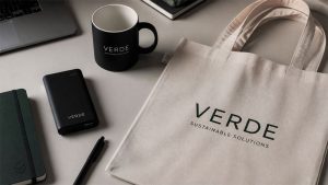 custom branded tote, coffee mug and other items on a desk